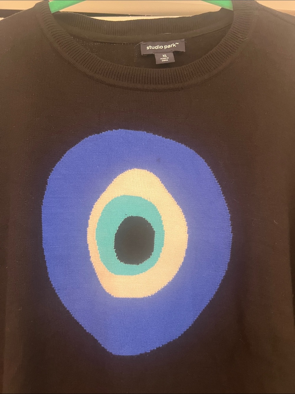 Studio Park Black Crewneck Sweater with Blue, Teal and Cream Target Motif